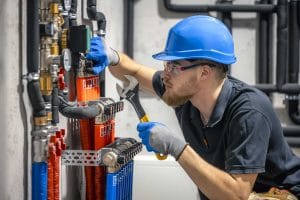 HVAC technician repairing heating system