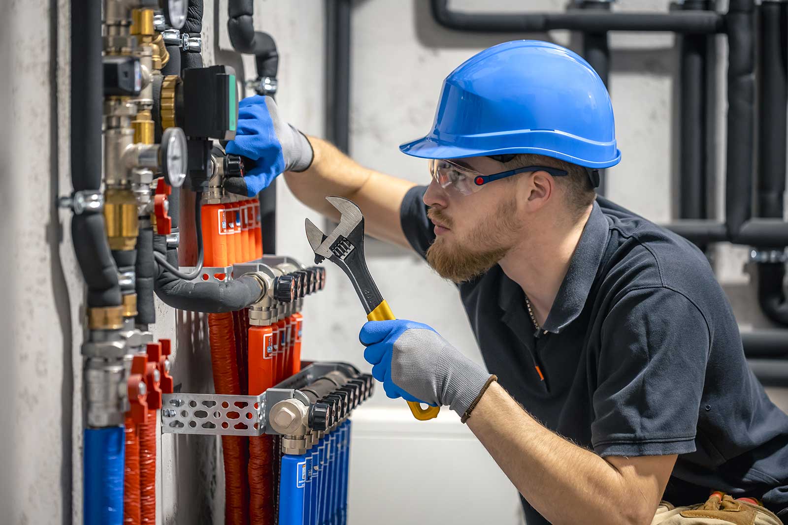 HVAC technician repairing heating system
