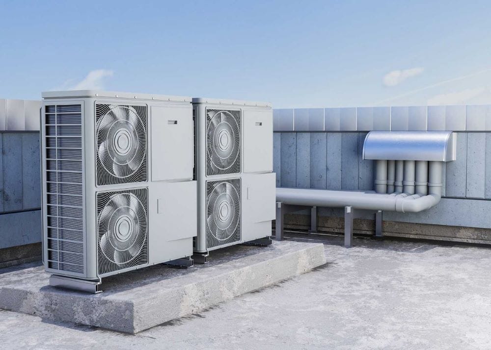 Four rooftop air conditioning units with visible fans