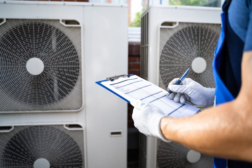 HVAC professional performing 24 hour AC repair inspection
